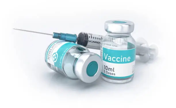 Syringe and vials filled with vaccine. Isolated on pure white.