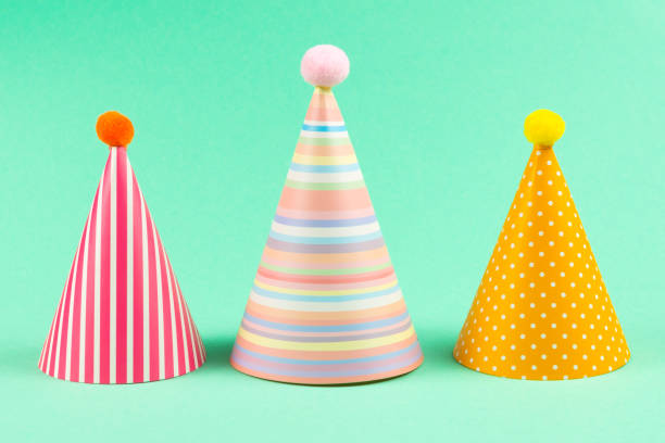istock Colorful birthday caps on mint background. 1212507043