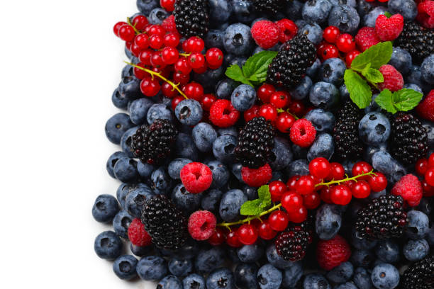 istock Blackberry, raspberry, blueberry,  red currant and mint background. 1212507093