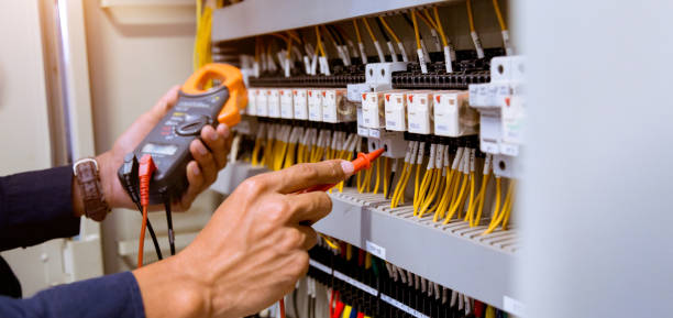 Electrician measurements with multimeter testing current electric in control panel. Electrician measurements with multimeter testing current electric in control panel. relay photos stock pictures, royalty-free photos & images
