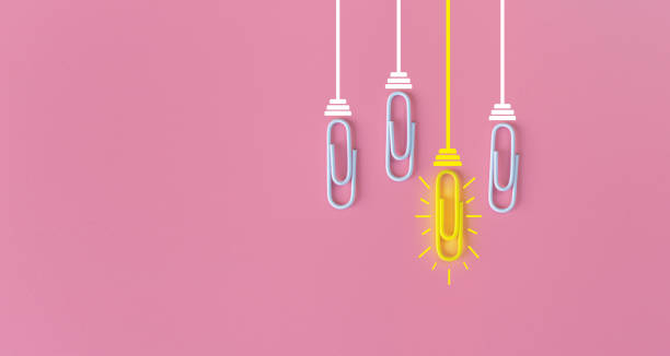 istock Great ideas concept with paperclip,thinking,creativity,light bulb on pink background,new ideas concept. 1212511053