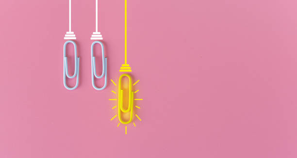 istock Great ideas concept with paperclip,thinking,creativity,light bulb on pink background,new ideas concept. 1212511198