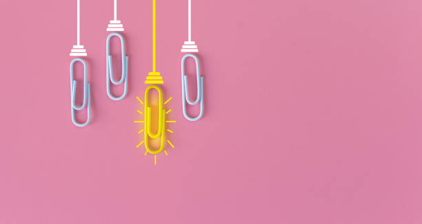 istock Great ideas concept with paperclip,thinking,creativity,light bulb on pink background,new ideas concept. 1212511214