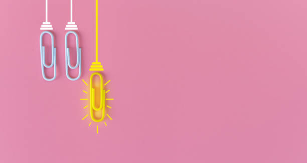 istock Great ideas concept with paperclip,thinking,creativity,light bulb on pink background,new ideas concept. 1212511298