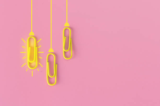 istock Great ideas concept with paperclip,thinking,creativity,light bulb on pink background,new ideas concept. 1212511437