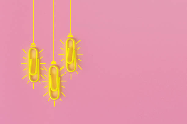 istock Great ideas concept with paperclip,thinking,creativity,light bulb on pink background,new ideas concept. 1212511459
