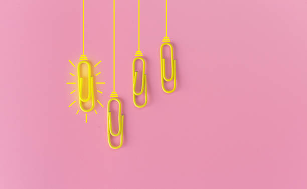 istock Great ideas concept with paperclip,thinking,creativity,light bulb on pink background,new ideas concept. 1212511464