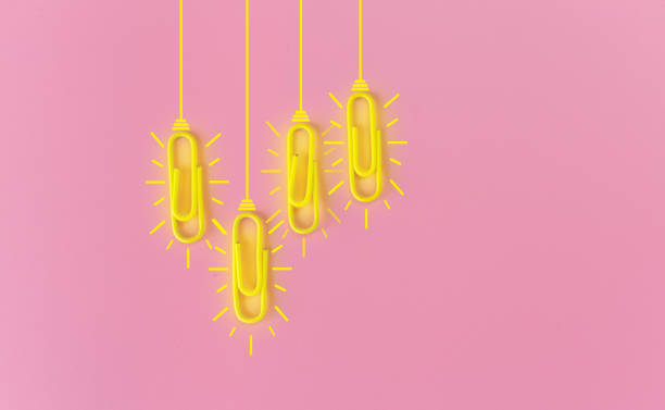istock Great ideas concept with paperclip,thinking,creativity,light bulb on pink background,new ideas concept. 1212511467