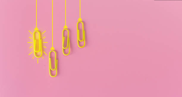 istock Great ideas concept with paperclip,thinking,creativity,light bulb on pink background,new ideas concept. 1212511498