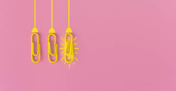 istock Great ideas concept with paperclip,thinking,creativity,light bulb on pink background,new ideas concept. 1212511607