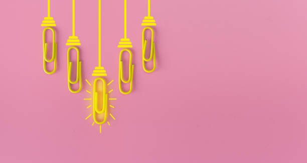 istock Great ideas concept with paperclip,thinking,creativity,light bulb on pink background,new ideas concept. 1212511671
