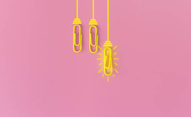istock Great ideas concept with paperclip,thinking,creativity,light bulb on pink background,new ideas concept. 1212511684