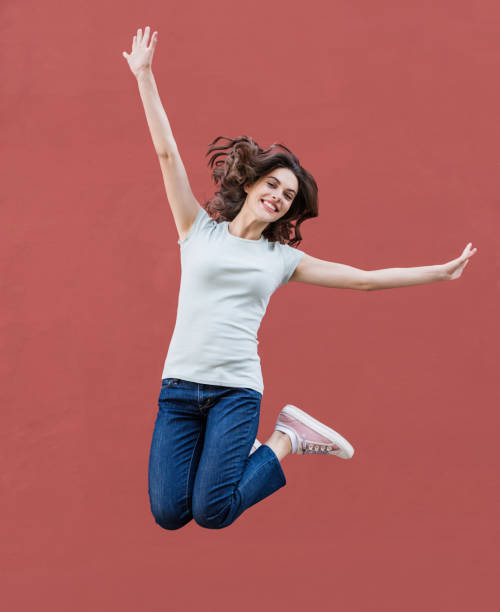 istock Happy girl jumping, celebrating and having fun 1212511875