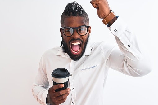 African american businessman with braids drinking coffee over isolated white background annoyed and frustrated shouting with anger, crazy and yelling with raised hand, anger concept