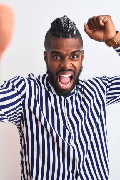 african american man with braids make selfie by camera over isolated white background annoyed and frustrated shouting with anger, crazy and yelling with raised hand, anger concept - bizarre making a face men one person imagens e fotografias de stock