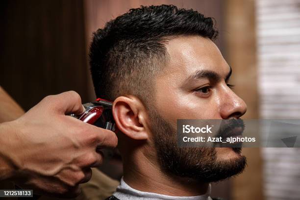 The Guy Is A Darkhaired Asian Indian Appearance On A Haircut In A  Barbershop Cinematic Image Stock Photo - Download Image Now - iStock