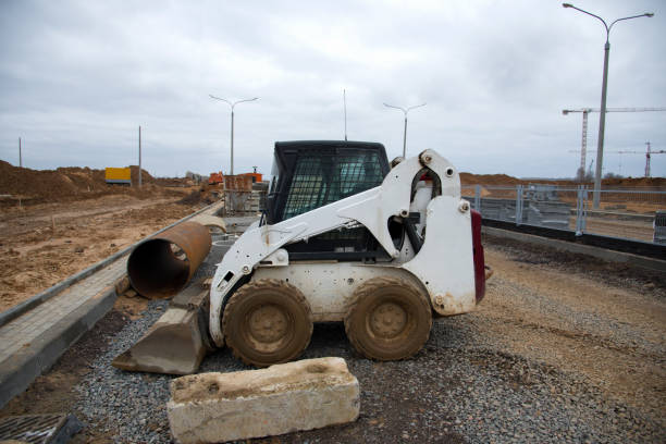 istock Bobcat skid-steer loader for loading and unloading works on city streets 1212520227