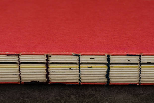 istock vintage style red cover wire-bound book closeup view 1212521994