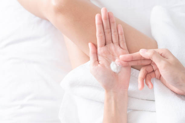 istock Woman applying moisturizing cream/lotion on hands, beauty concept. 1212522733