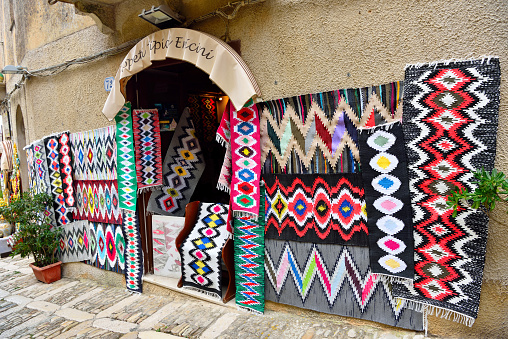 characteristic carpet shop in the historic center of the village September 24 2019 Erice Sicily Italy