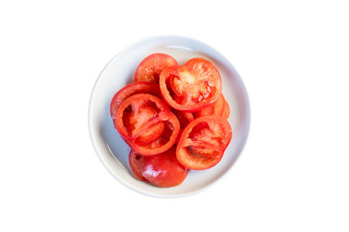 Overhead round plate of tomato.