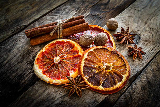 istock Scented spices: dried orange slices, cinnamon, star anise and nutmeg 1212527453