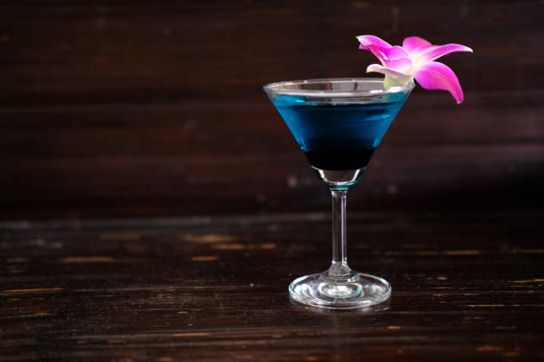 istock Blue martini cocktails on counter background 1212531080