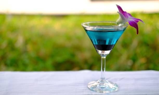 istock Blue martini cocktails on counter background 1212531132