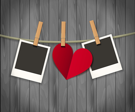 Two photo frames and heart for valentines day hanging on rope on the wood background. Vector illustration. EPS 10