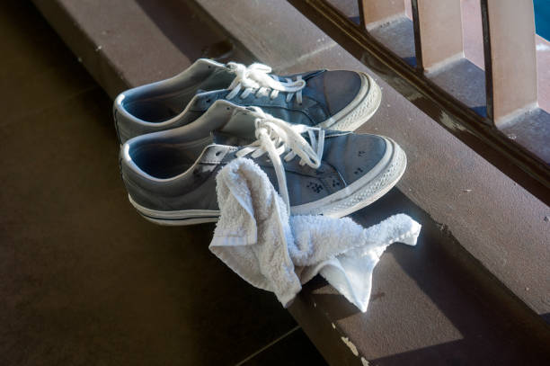 istock Cleaning dirty trainers 1212537826
