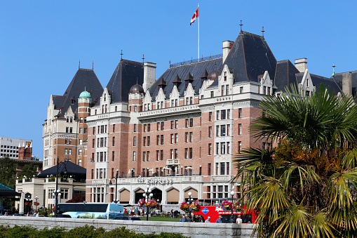 Victoria, British Columbia, Canada - July 27, 2018 -The Fairmont Empress Hotel facade in Victoria, British Columbia, Canada. It is one of the oldest and most prominent hotels in Victoria