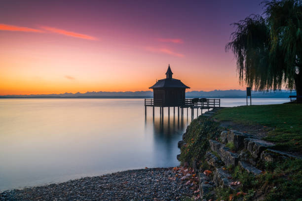 long exposure before sunrise at Lake Neuchâtel in the pavilion in the water near Gorgier, Switzerland stock photo