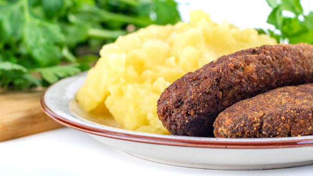 istock meatballs with mashed potatoes and parsley on a white background 1212542877