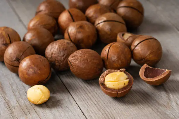 macadamia nuts on wooden table