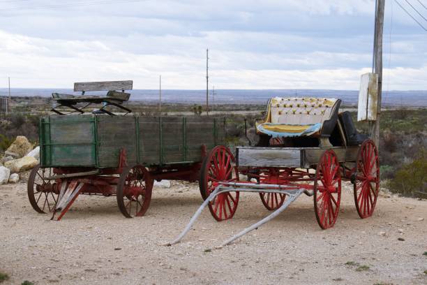 istock Transportation in old west, green wagon and buggy with cushion seat 1212543254
