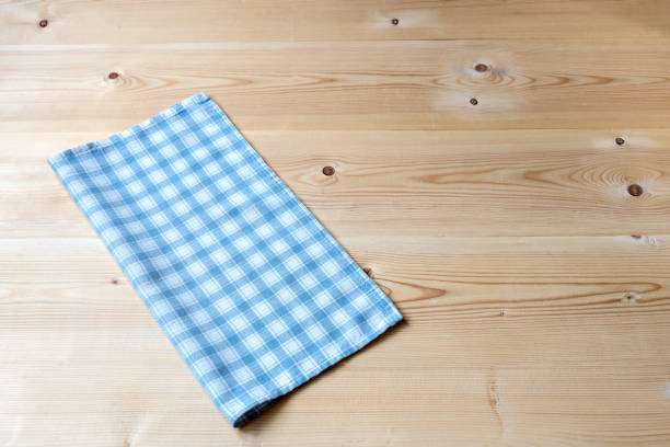 istock Background with checkered blue napkin on a wooden table. Copy space. 1212543269