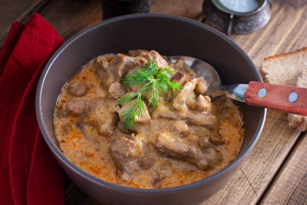 istock Traditional beef stroganoff in a ceramic bowl on a wooden table, selective focus 1212543631