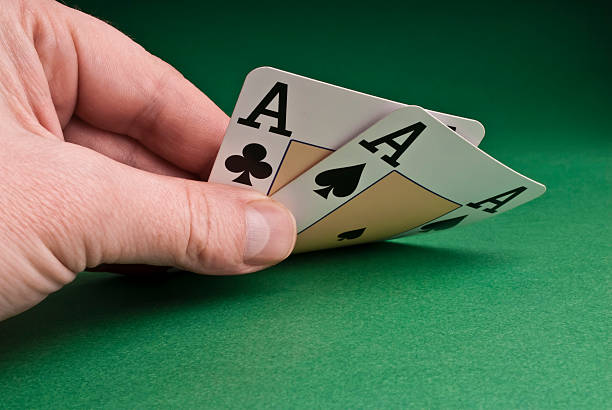 istock Players hand revealing two aces 121254364