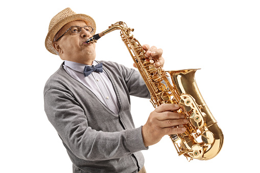 Mature male musician playing a saxophone isolated on white background