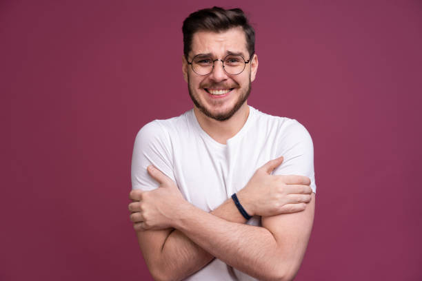 istock I'm afraid. Fright. Scared man. Business man standing isolated on trendy pink studio background. Human emotions, facial expression concept. 1212549981