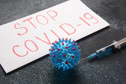 Vaccine for corona-virus 2019-nCoV. Photo of vaccine, medical injection and corona-virus.Stop corona-virus