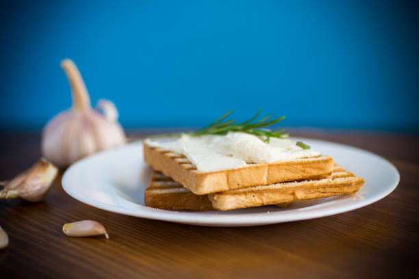 fried toast bread with garlic curd filling on a wooden table
