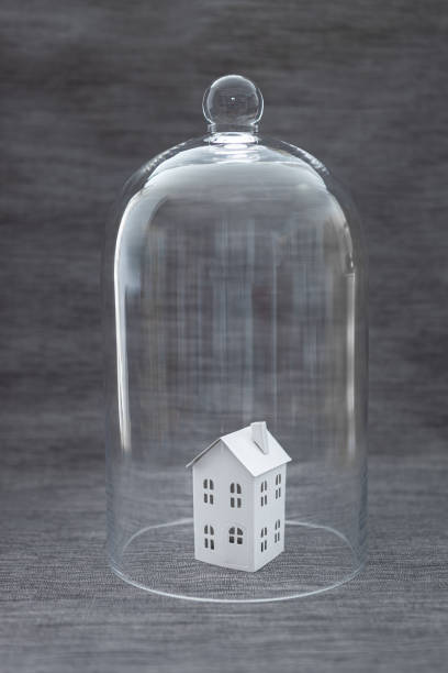 istock Little house in bell jar 1212553256
