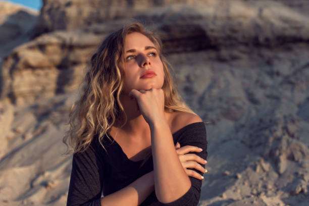 istock Walking in nature with a young curly blonde 1212554341