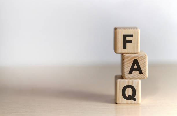 istock FAQ - text on wooden cubes, on wooden background 1212555907