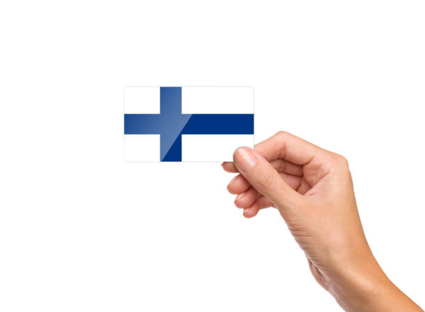 istock Beautiful hand holding Finland flag card on white background 1212556183