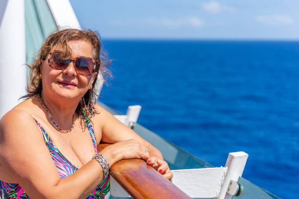 istock Senior Hispanic woman at sea 1212556237