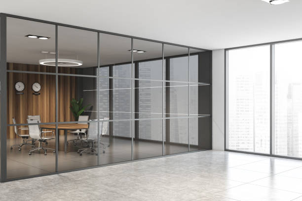 istock Wooden conference room in white office 1212556366
