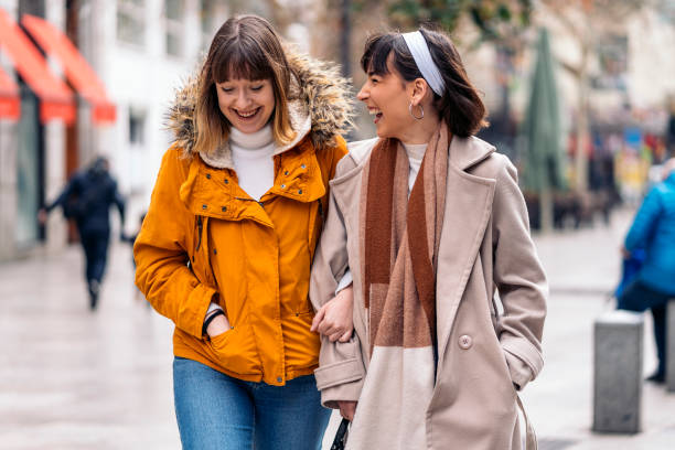 istock Cute young girls holding arms. 1212556416