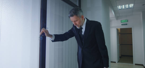 istock Coworkers running to help ill manager 1212557157